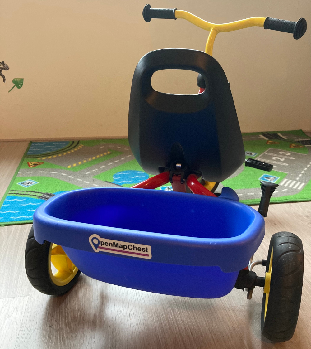 tricycle with OpenMapChest logo